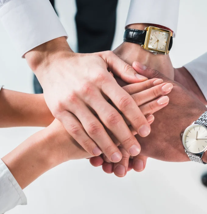 people-putting-stacked-hands-together-promising-help-support-against-white-backdrop